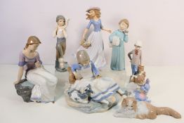 A collection of Nao and similar figures / groups, children and ladies,