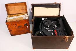 A vintage Pathescope Son projector in carry case and a small quantity of cine reels. [2].