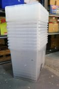 Ten 80L plastic storage boxes with lids.