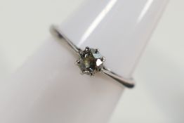 A white metal (stamped Platinum) diamond solitaire ring, estimated diamond weight 0.