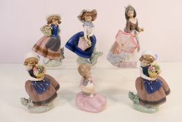 A collection of Lladro and Nao figures depicting young girls with flowers and animals,