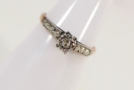A yellow metal (stamped 18ct / PLAT) with illusion set diamond, size K+½,