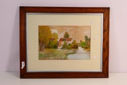A watercolour riverside landscape scene, signed lower left and dated 1914,