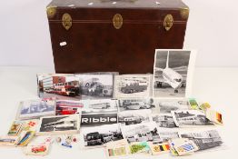 A storage case containing a quantity of tea cards, pin badges,