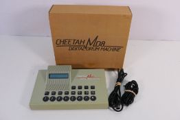 A boxed Cheetah MD8 Digital Drum Machine.