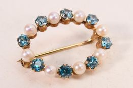 A rose metal, stone set brooch of oval form, 2.