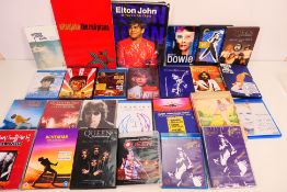 A collection of music related DVDs and Blu-ray discs to include Elton John, David Bowie, Queen,