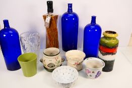 Mixed ceramics and glassware to include a vintage West German vase, blue glass bottles and other.