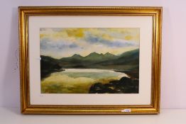 An atmospheric watercolour landscape scene, signed lower left by the artist,