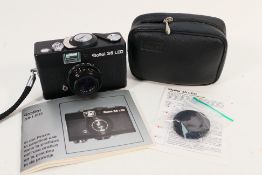 A Rollei 35 LED film camera with Rollei Triotar f/3.5 40 mm lens, case and instructions.