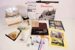 A mixed lot to include an Atomium, Brussels desk ornament, hand fans, vintage technical drawing set,