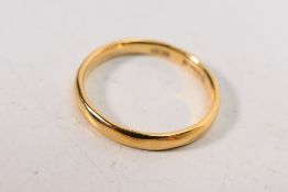 A 22ct gold wedding band, size J+½, approximately 2.6 grams.