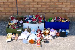 Three boxes of various dolls.