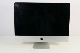 An Apple iMac computer, 21.5 cm screen size, no accessories.