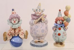 Lladro - Three clown figures comprising # 6938, The Show Begins, # 5813, Having A Ball and # 5811,