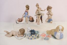 A quantity of Lladro, Nao and similar figures / groups to include # 6496, # 6497, # 6229,