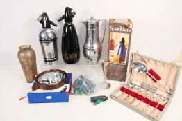 Lot to include Sparklets syphons, white metal vases, cased flatware and other.