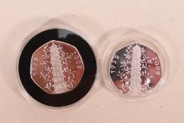 Two reproduction Kew Gardens fifty pence (50p) coins, marked below portrait IRB Copy.