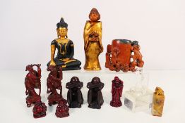 A collection of Chinese and Japanese style ornaments and decorative objects to include soapstone