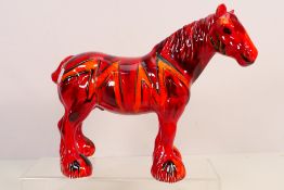 Anita Harris - A large shire horse figure in red, orange and black colourway,