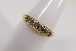 An 18ct yellow gold ring set with five d