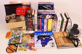 A mixed lot to include DVDs, various pub