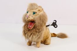 Carl Max - A paper mache bodied lion covered in felt and fur with a head that tilts back and