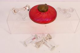 An Art Nouveau inkwell of flattened form in iridescent cranberry glass,