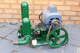 A vintage Coventry Climax water pump with attached Hoover A.C. Motor.