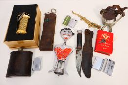 A mixed lot of vintage collectibles to include a knife in sheath, stirrups, leather clad hip flask,