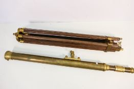 A vintage brass telescope, 96 cm (l) on a wood and brass adjustable tripod. [2].