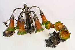 A decorative seven branch chandelier with Angels Trumpet form shades and a matching three branch