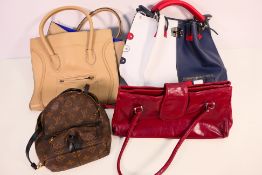 A collection of various handbags.