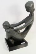 An Austin Productions sculpture designed by Kathy Klein, Generations, depicting a mother and child,