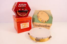 A Galotta 20 key concertina, contained in original box and a boxed New Era tambourine.