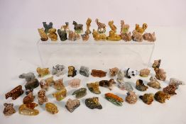 A collection of Wade Whimsies and similar figures to include Disney examples.