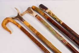 Five walking staves or hiking poles with