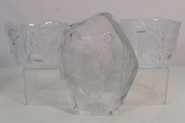 Two pieces of Kosta Boda glassware, Rhapsody pattern bowls featuring traditional Swedish motifs,
