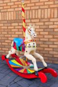 A vintage fairground carousel horse converted to a rocking horse with bow rockers,
