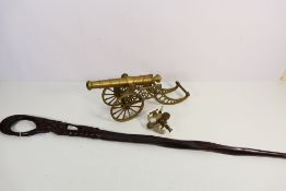 Lot to include a brass model of a cannon, 40 cm (l),