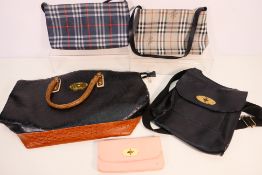 Five fashion handbags / purses.