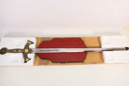 A decorative fantasy Knights Templar style sword display with wall mountable hanging plaque,