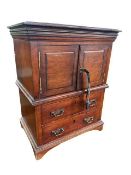 Miniature mahogany cupboard having double doors above two drawers on bracket feet,