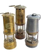 Three miners lamps.