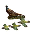 Set of three graduated Beswick Woodpecker wall plaques number 1344 and a Beswick Pheasant number