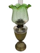 Edwardian brass and glass oil lamp with green tinted shade.