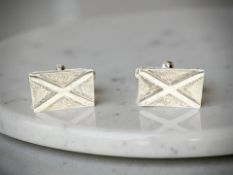 A pair of Kit Heath Scottish silver cuff links formed as Saint Andrew's Cross or Saltire,