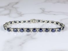 An 18ct white gold sapphire and diamond bracelet,