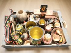 A collection of European lacquered wooden wares including various vessels,