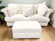 A contemporary three seater settee, with scatter cushions, in cream upholstery,